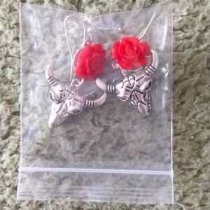 ** Skull and rose earrings.